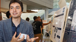 Two students discuss a poster at SciFest